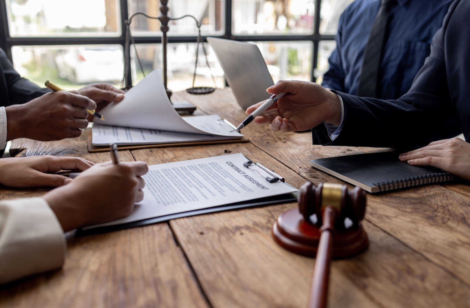 Lawyer’s in a meeting with two people.