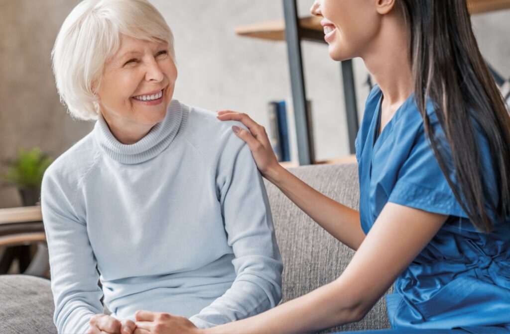 Senior Living worker and senior woman having a conversation.